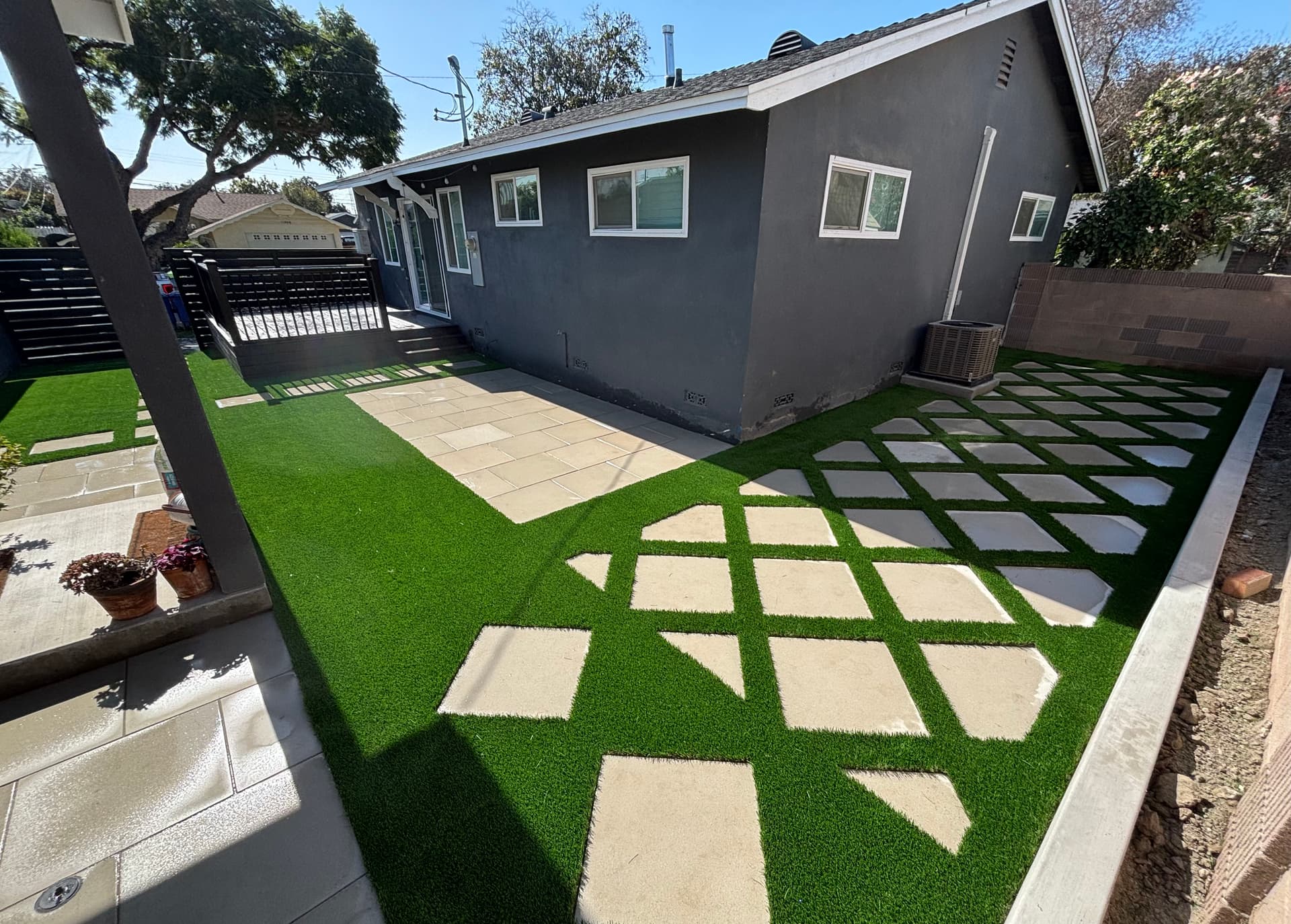 Backyard Makeover with Artificial Turf and Pavers in Lakewood